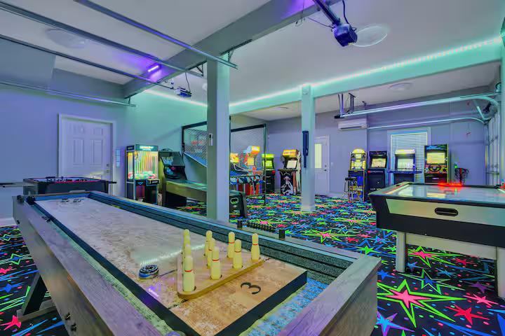 Arcade game room with classic machines and LED carpet
